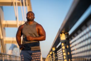 Stocky Man Jogging with a Smile. How can obese men gain the same motivation?